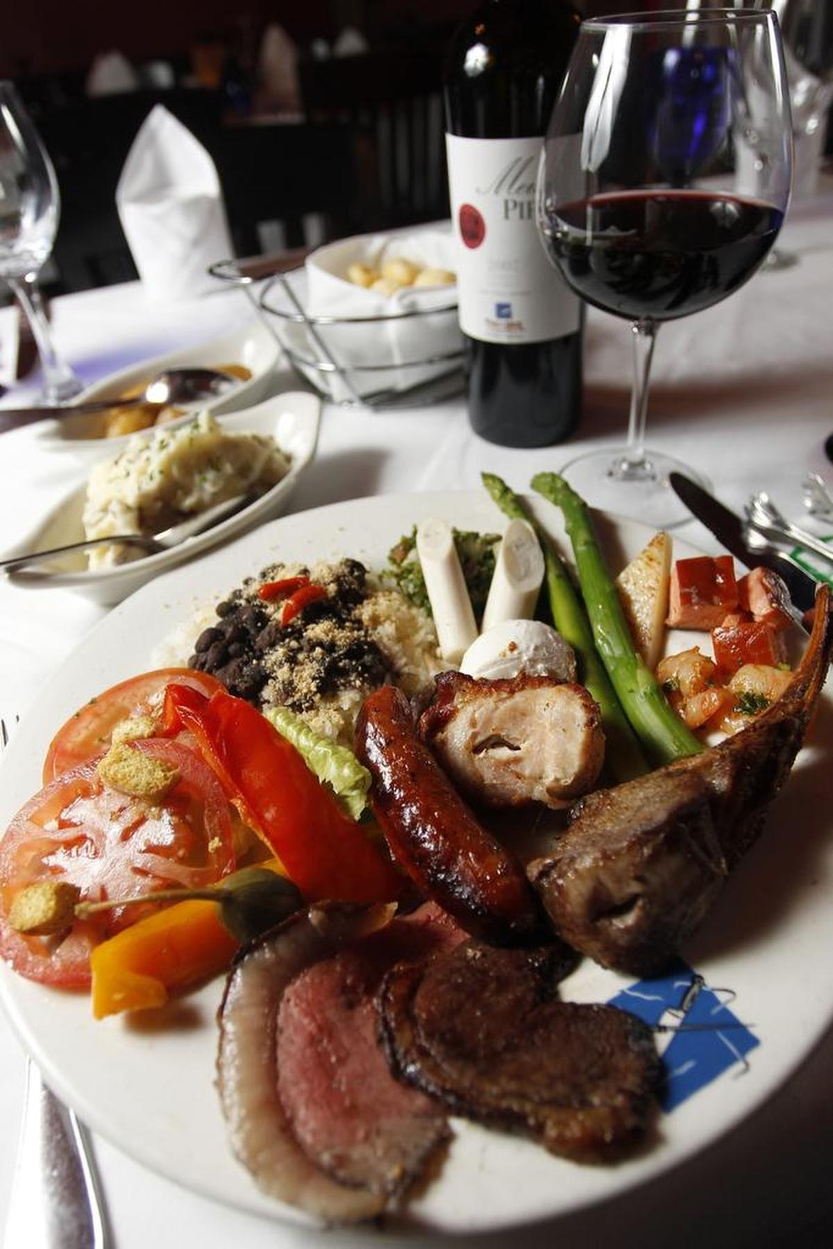 Picanha, lamb, sausage and salad bar items at Texas De Brazil