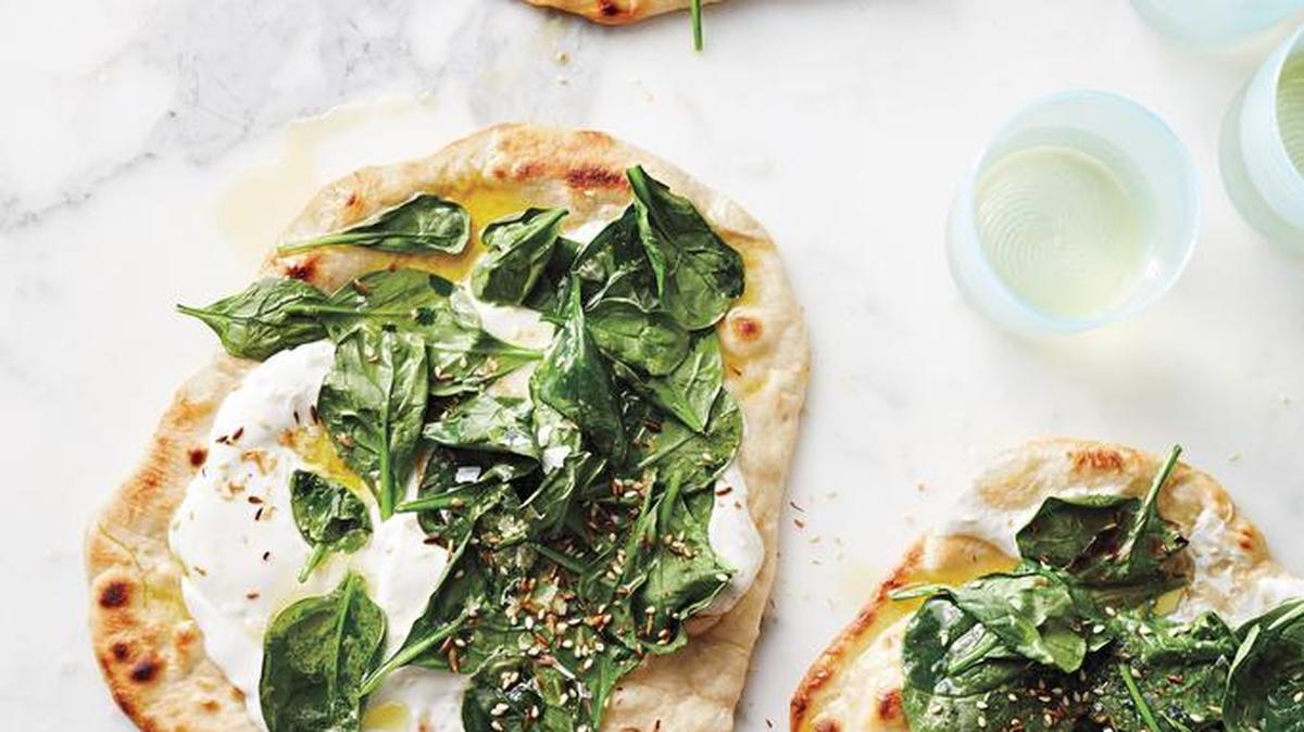 Top a Pizza: The finishing touch for these Spinach-and-Yogurt Flatbreads: a sprinkling of toasted coconut, cumin and sesame seeds (a take on dukka, an Egyptian spice blend