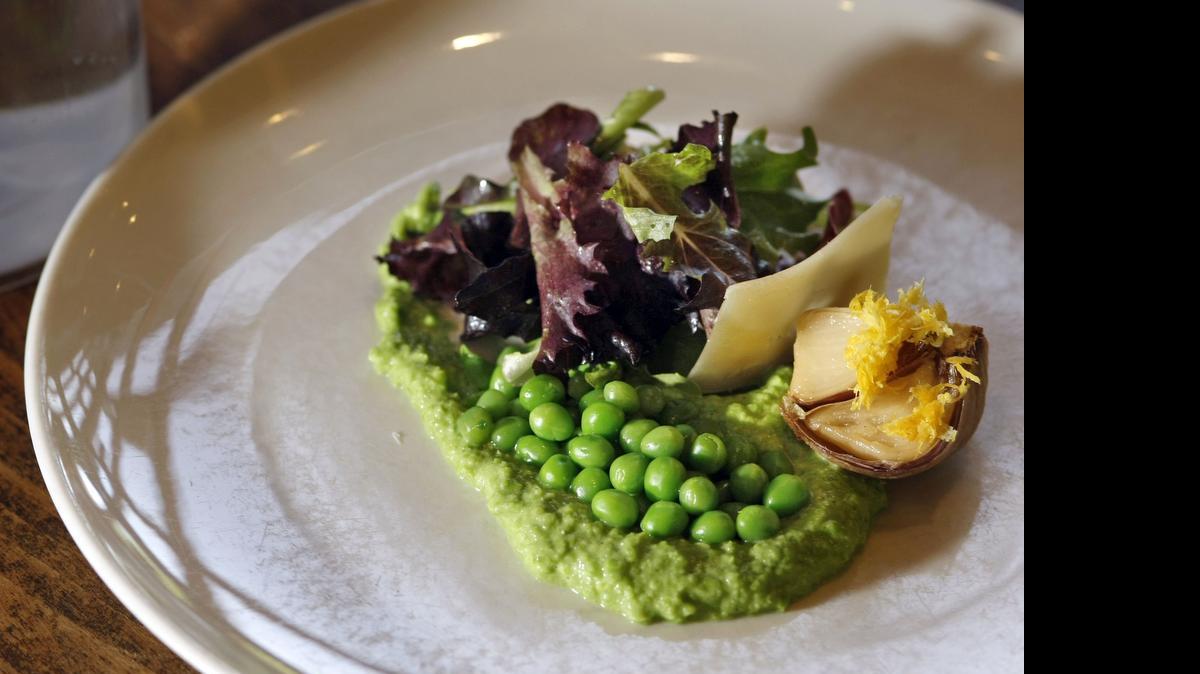 
Potager's lemon roasted spring garlic, garden peas, and field greens

