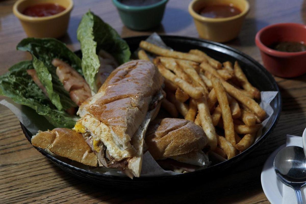 The Lomito Argentino — a large Argentine-style sandwich with grilled steak, fried eggs, jack cheese, ham and more — at Tio Carlos Mexican-Latin Grill in Colleyville.