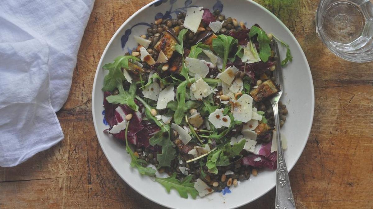 Cook the lentils in advance and then warm them up when the eggplant is roasted for this simple fall-inspired salad.