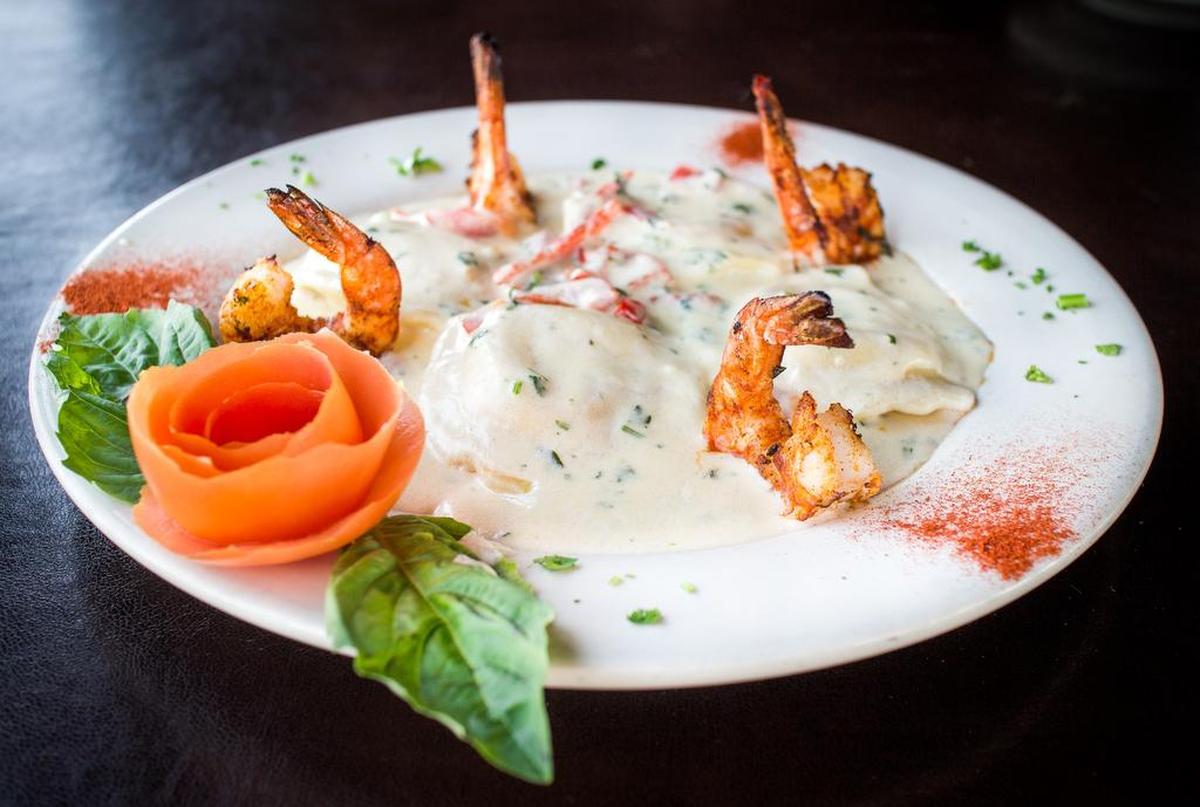 Lobster ravioli is topped with cream sauce and shrimp at Mamma Mia Italian Grill.