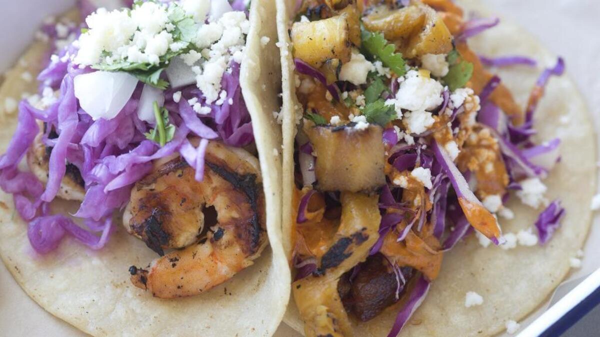 Garlic cilantro gulf shrimp taco and Nuevo Leon al pastor taco at Taco Heads in Fort Worth