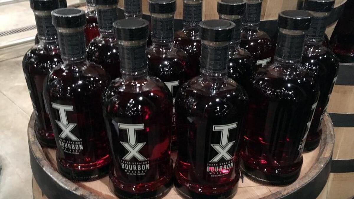 Some of the first TX Straight Bourbon Whiskey bottles were revealed at a tasting on Wednesday night at Firestone and Robertson Distilling Co. in Fort Worth.