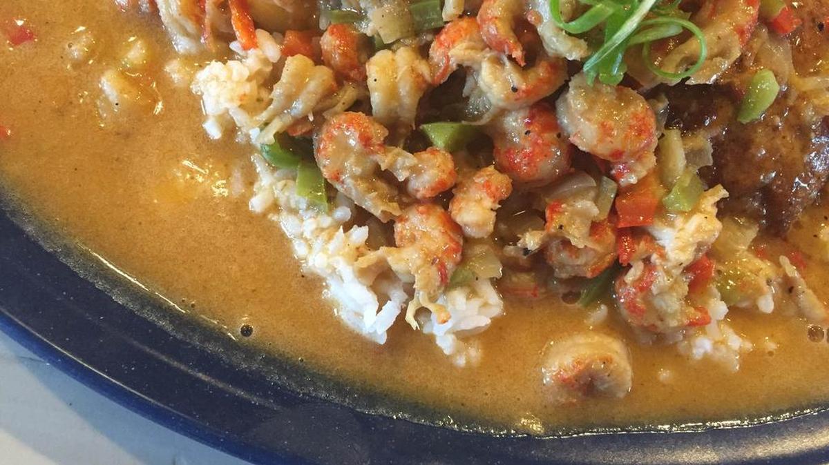 Blackened redfish with étouffée at The Dive Oyster Bar.