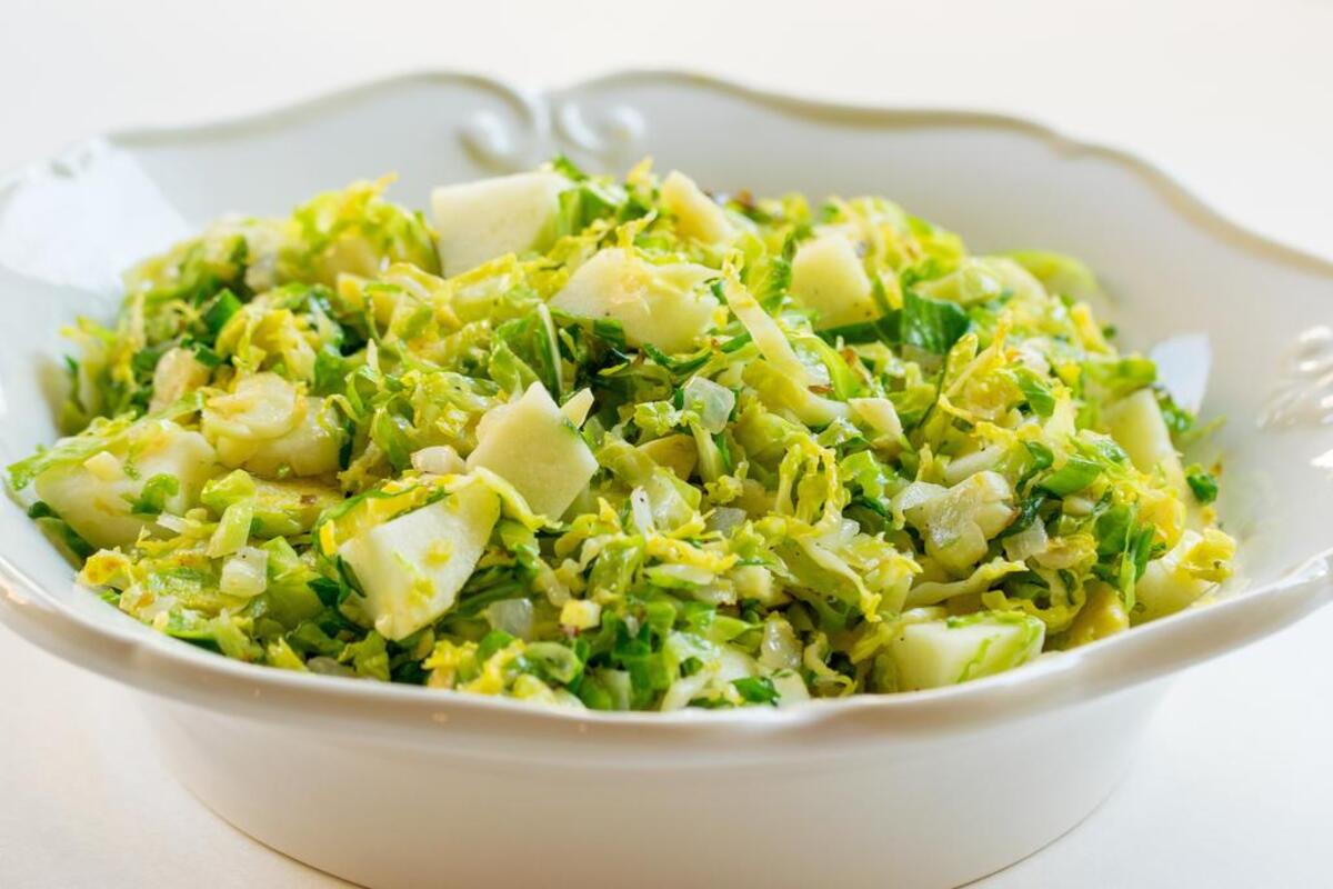Shaved Brussels sprouts with onion and apple add “green” to your meal. Add bacon for a little something extra.