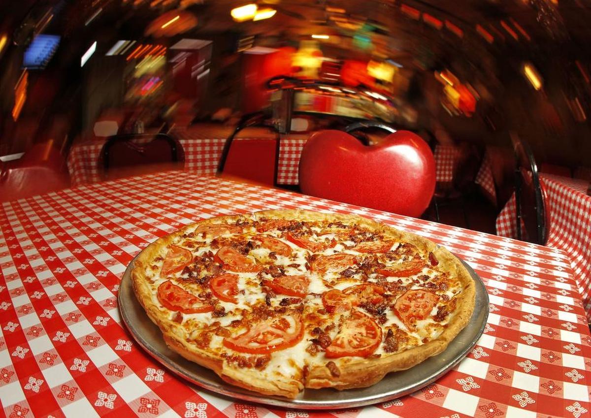 Parton’s signature bacon and tomato pizza