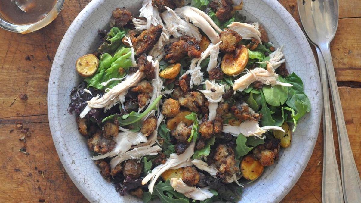 Whip up a quick balsamic vinaigrette and you’re on your way to eating this Leafy salad with turkey, roasted potatoes and stuffing croutons for dinner.