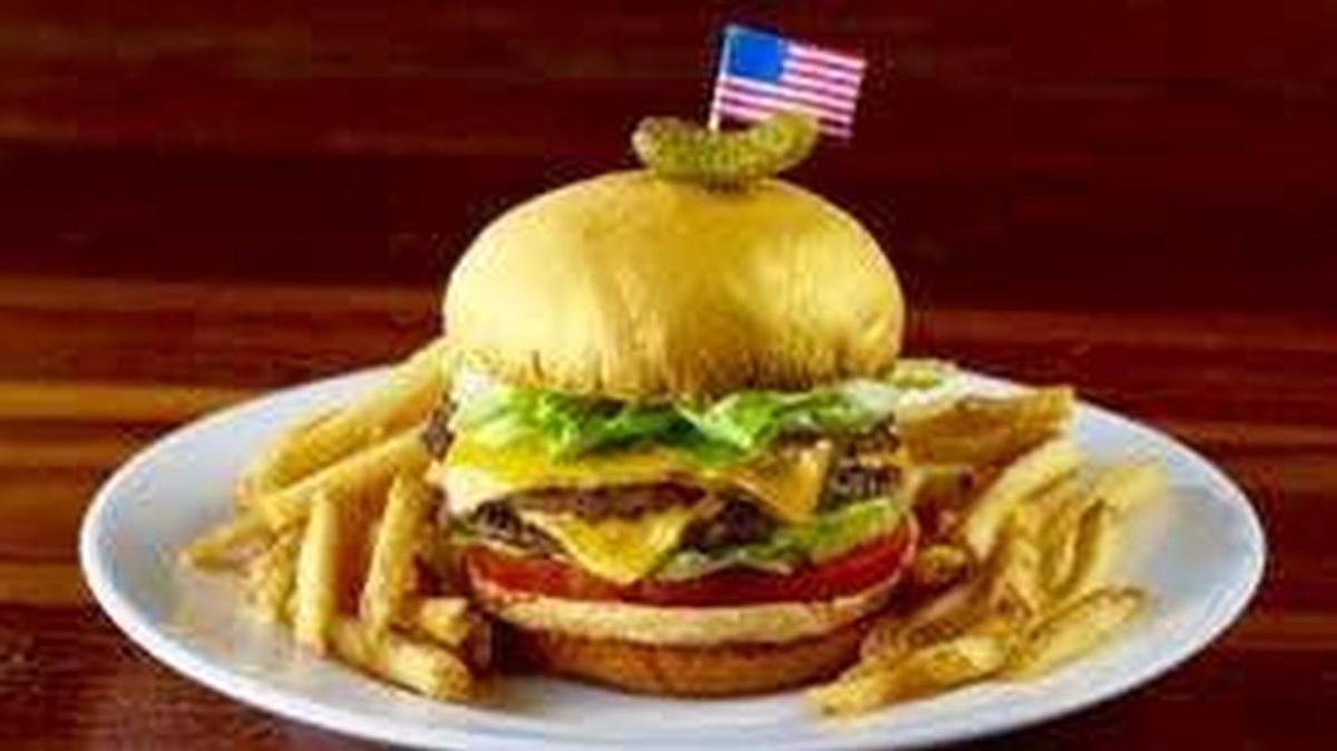 The “Donald Burger” at Del Frisco’s Grille is well-cooked and cheesy with a tiny pickle.