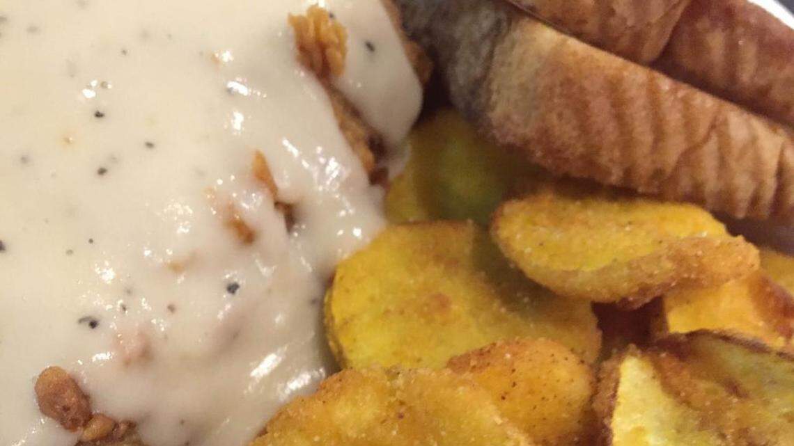 Fried squash with chicken-fried steak at Chef Blythe’s Southern Bistro