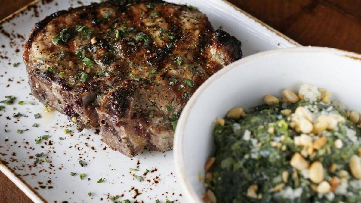 Pork loin and creamed spinach at Press Cafe in Fort Worth