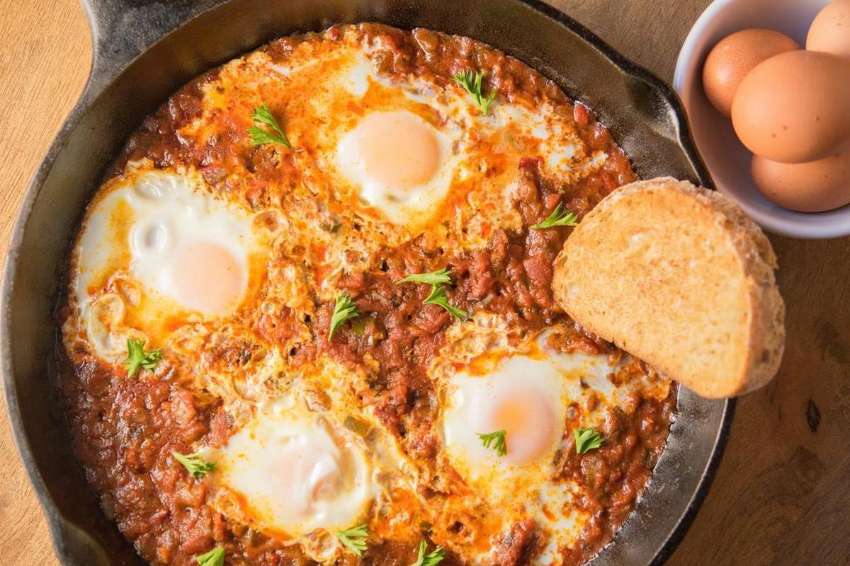 To make shakshuka, poach the eggs right in the tomato sauce for a one-pan meal.