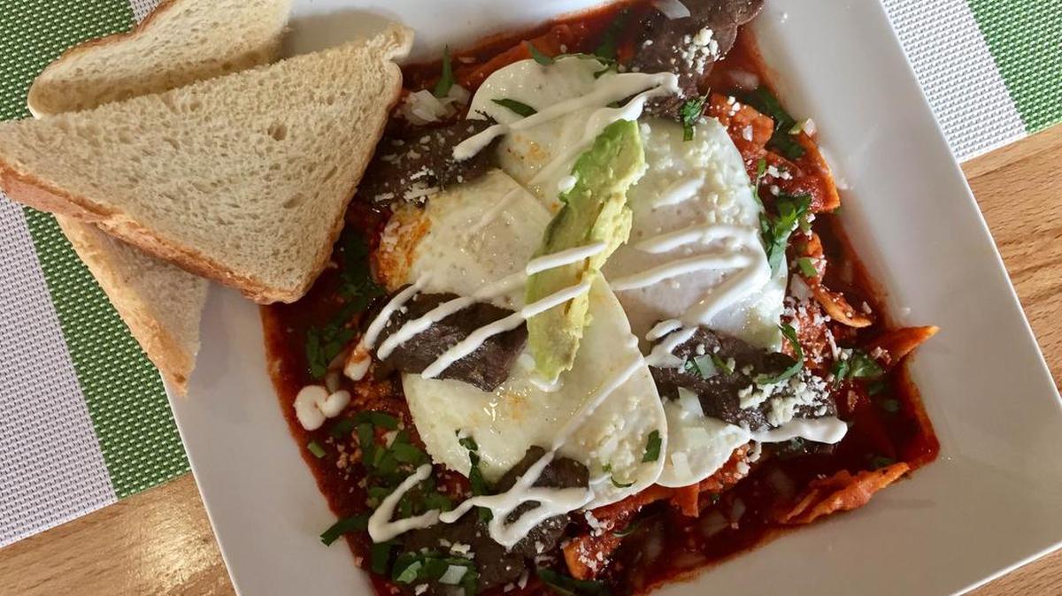 Chilaquiles guajillos with fried eggs and beef at Revolver Taco.
