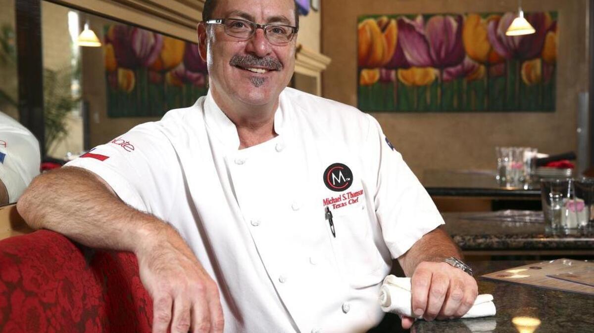 Chef Michael Thompson poses for a portrait in his restaurant Michaels Cuisine Restaurant and Bar .