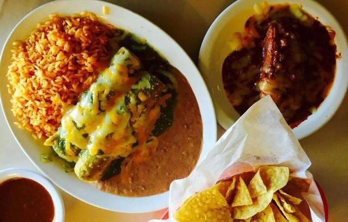 Green chicken enchiladas and a tamal at Cardona Foods.