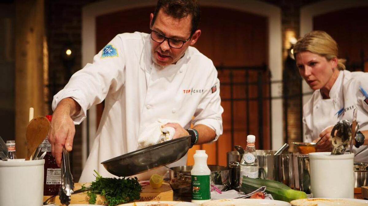 Dallas chef John Tesar and former Fort Worth and Dallas chef Casey Thompson in a photo from the premiere episode of the upcoming season of Top Chef. The season, premiering Dec. 1 on Bravo, pits eight returning “cheftestants” (including Tesar and Thompson) against eight “newbies” on the show.