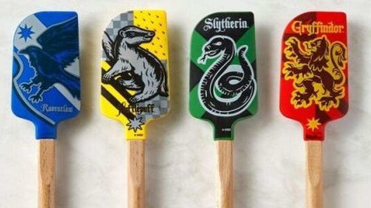 Williams Sonoma’s new line of Harry Potter-themed cookware features spatulas bearing the emblems of Hogwarts’ four houses.