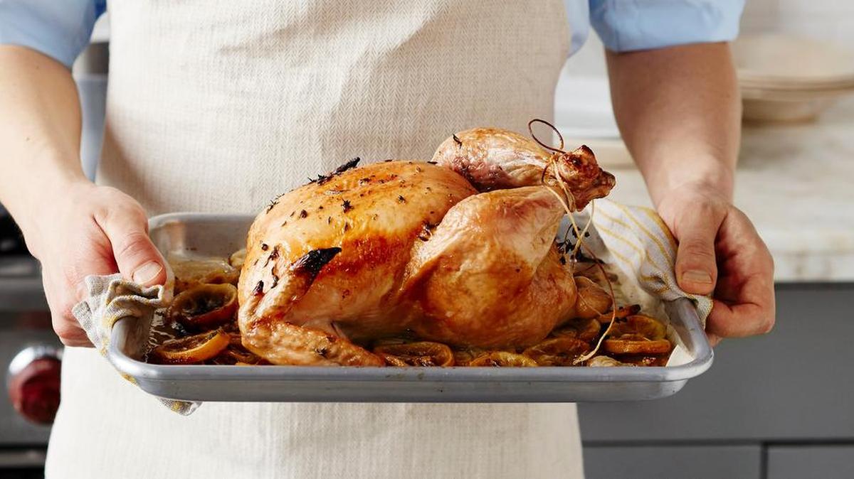 Tying the legs with twine closes the breast cavity, which helps the bird cook evenly and hold its shape.