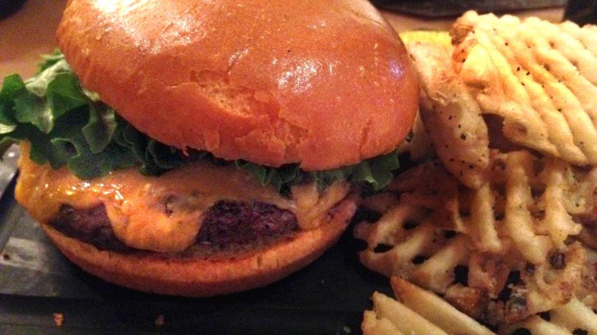 The half-pound black Angus cheeseburger at the Cast Iron Restaurant inside the Omni Fort Worth Hotel