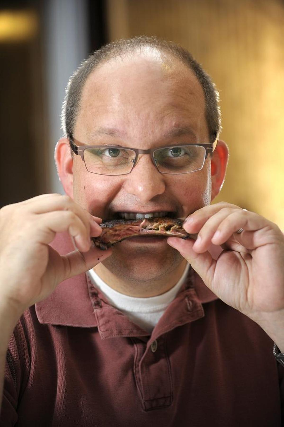 Texas Monthly barbecue editor Daniel Vaughn (shown sampling the ribs at Angelo’s in a 2013 file photo).