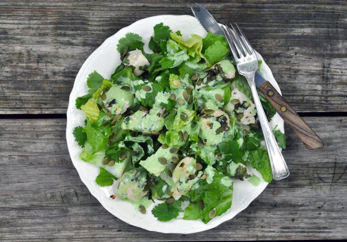Marinated chicken goes green in this salad, a simple toss-up of romaine with a tangy cilantro dressing
