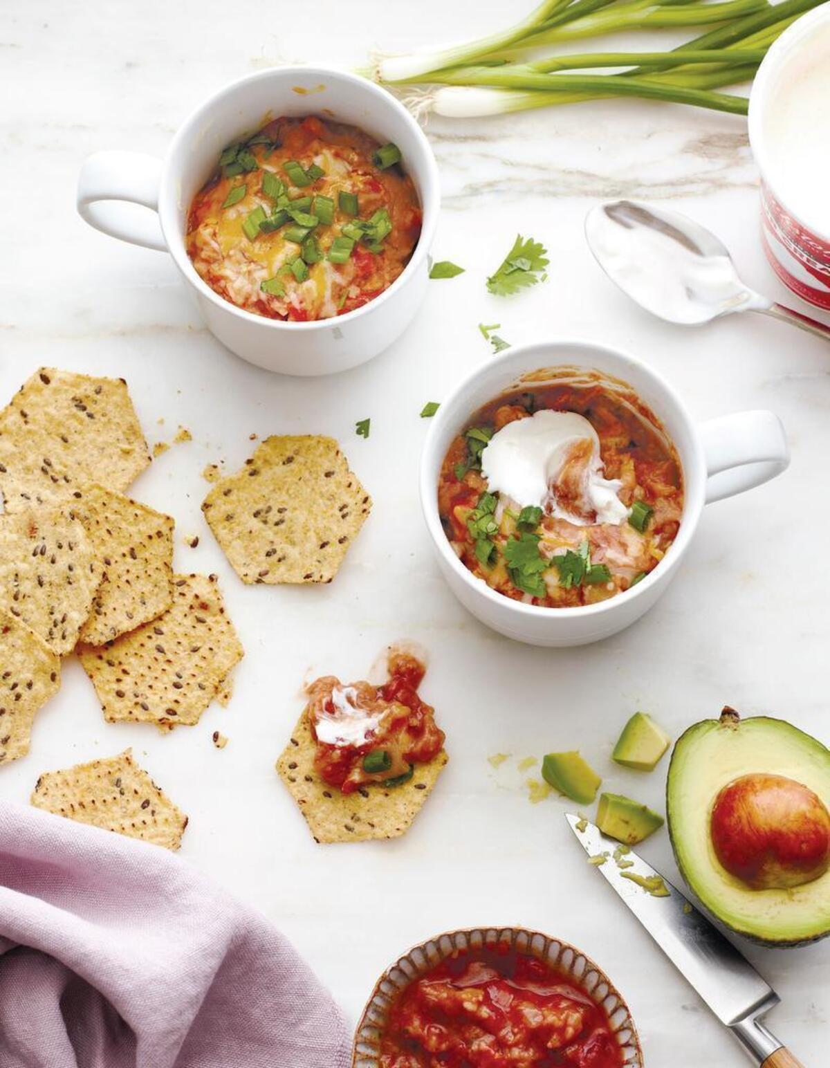 Nachos with refried beans and avocados