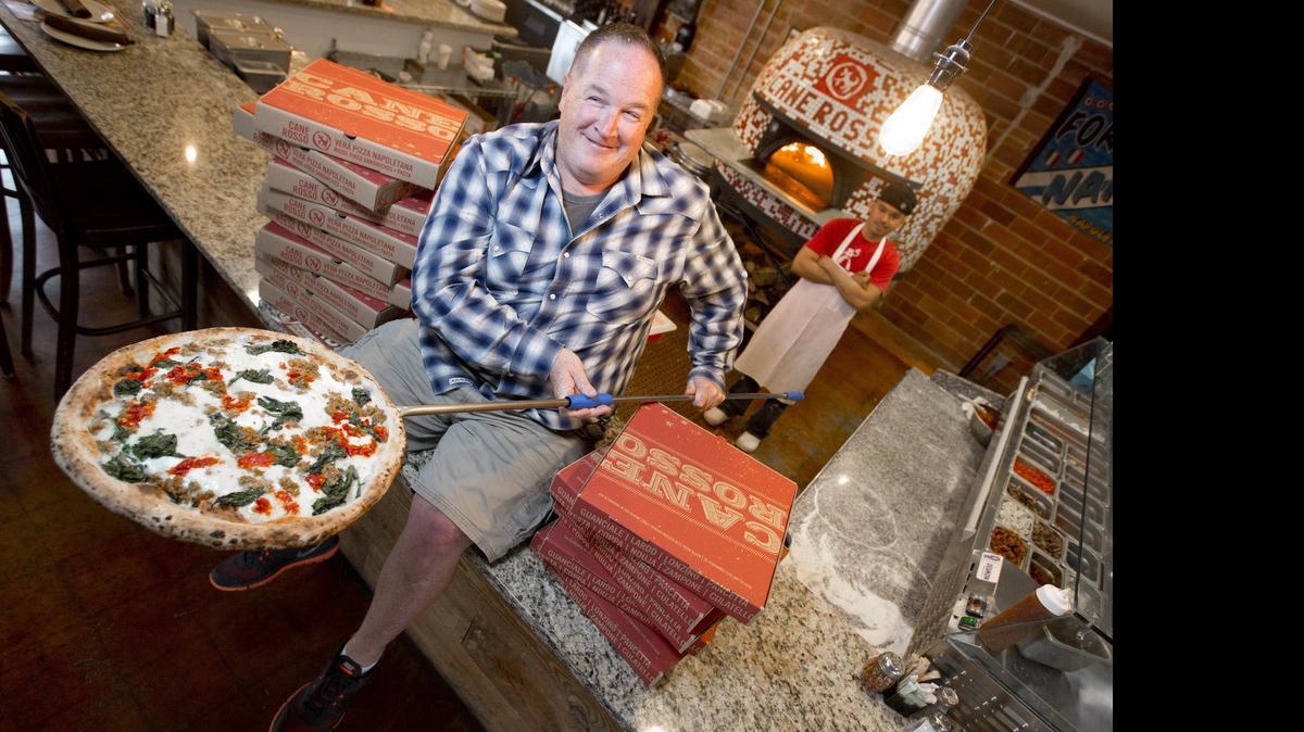 
Jay Jerrier, the man behind the expanding Cane Rosso pizza empire, as well as Zoli's NY Style pizza, at his Fort Worth store. 
