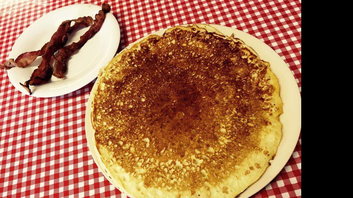 
A giant pancake dominates the table at River Oaks Cafe. (That’s just one.)
