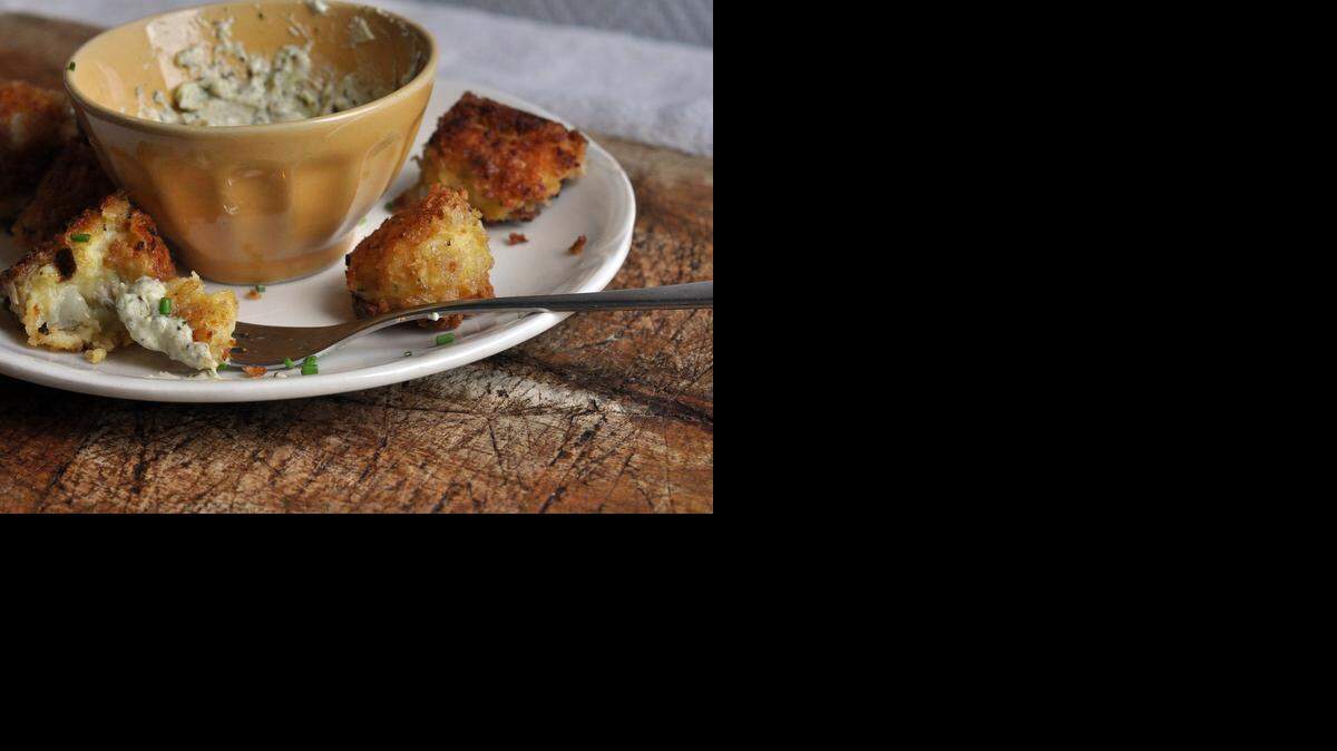 
A crispy coating surrounds cheesy, creamy artichoke filling in this recipe for mashed potato and artichoke croquettes. 
