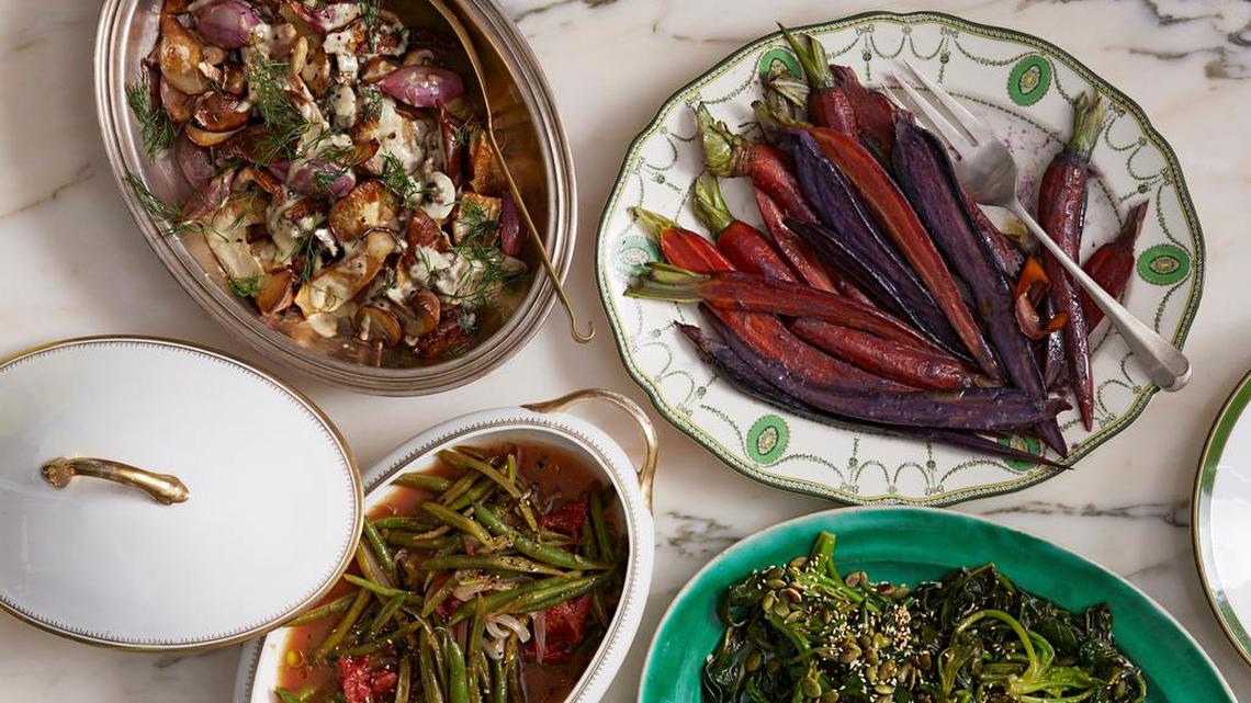(Clockwise, from top left) pan-seared mushrooms with cream and dill; miso-and-honey-glazed carrots; sauteed spinach with oepitas and sesame seeds; and braised green beans with tomatoes.