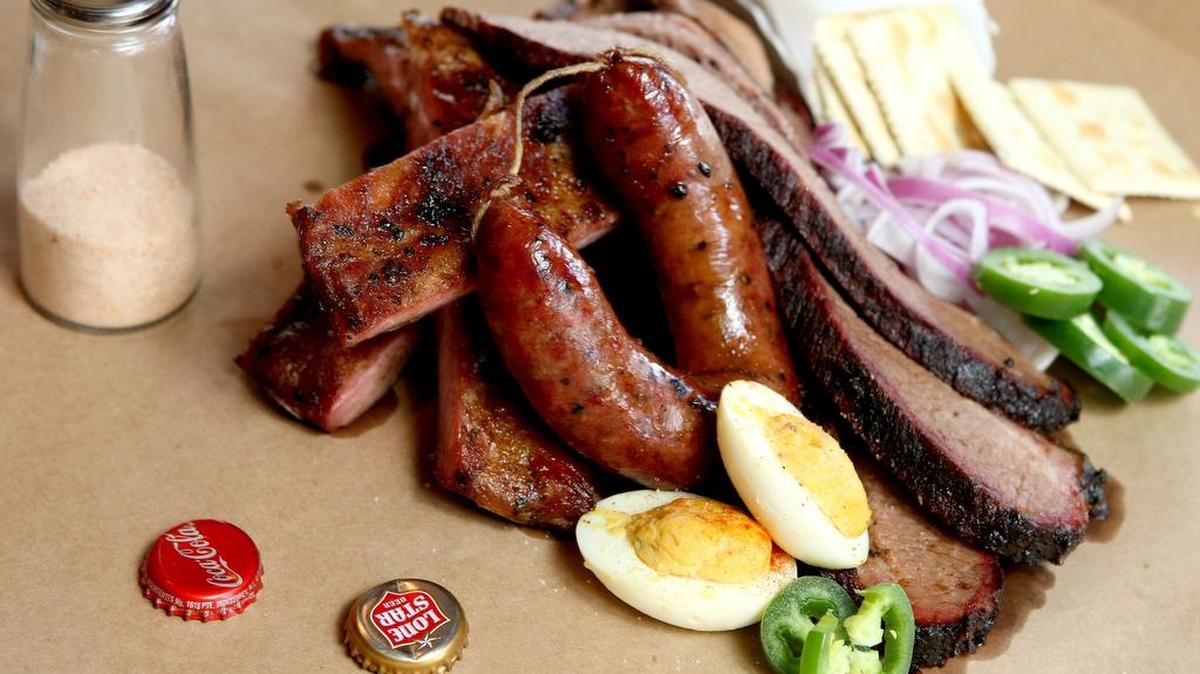 A meat combo of brisket, ribs, and sausage at Lockhart Smokehouse in Dallas.