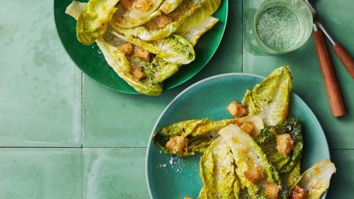 The classic recipe calls for whole romaine leaves rather than chopped — better for catching the croutons and dressing.