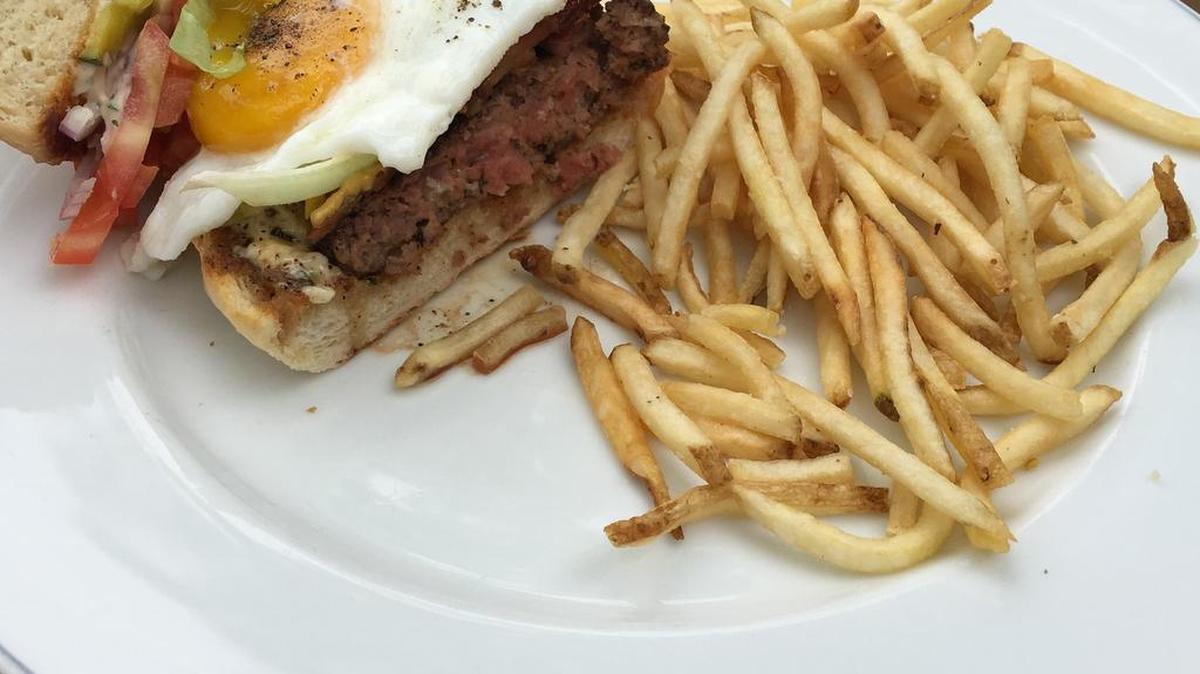 The Brunch Burger with fries at The Theodore in Dallas