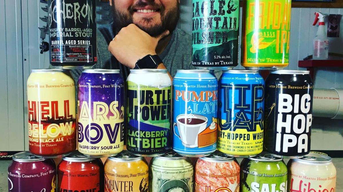 Cody Martin, founder and head brewer at Martin House, surrounded by some of his brands.
