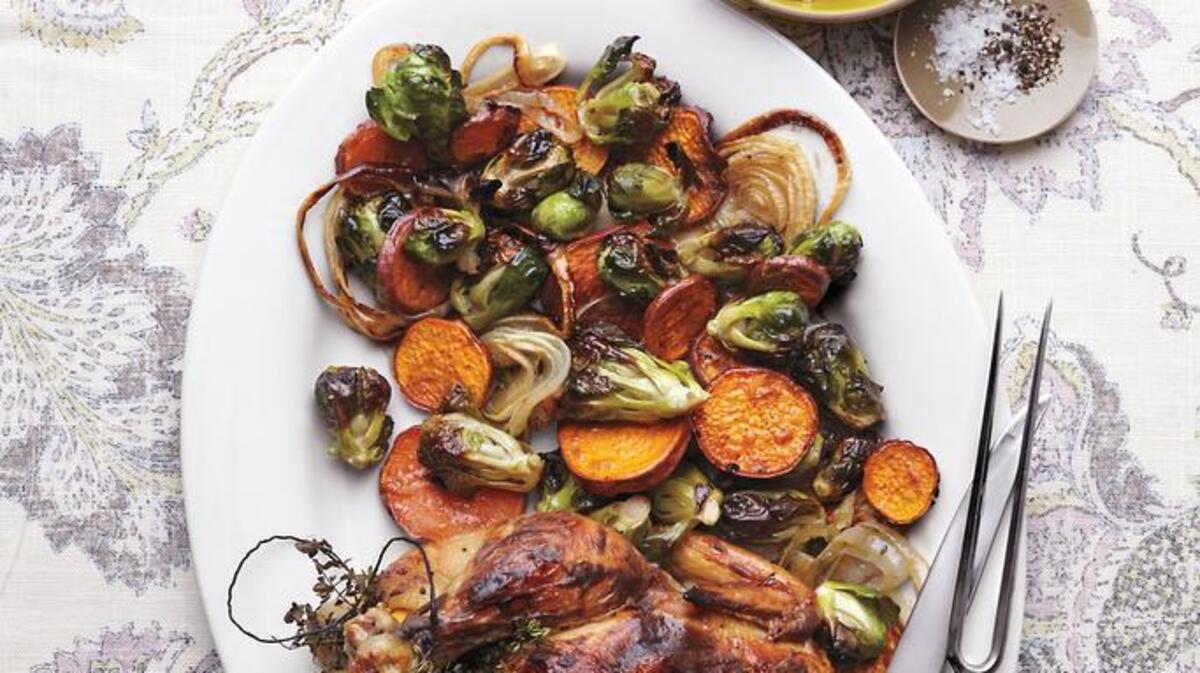 A Perfect Dinner: Serve this crispy Whole Roasted Mustard Chicken, paired with roasted vegetables, and watch everyone dig in.