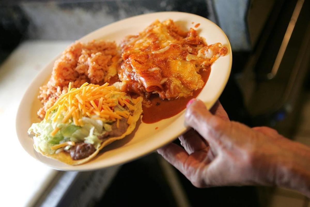 Cheese enchiladas and a tostada with rice and beans, in a 2006 file photo, at Aguilera’s Cafe.