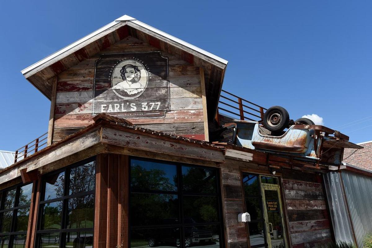 An upside-down pickup hangs over one of the entrances to Earl's 377 Pizza, which is located in a former fire station in Argyle.