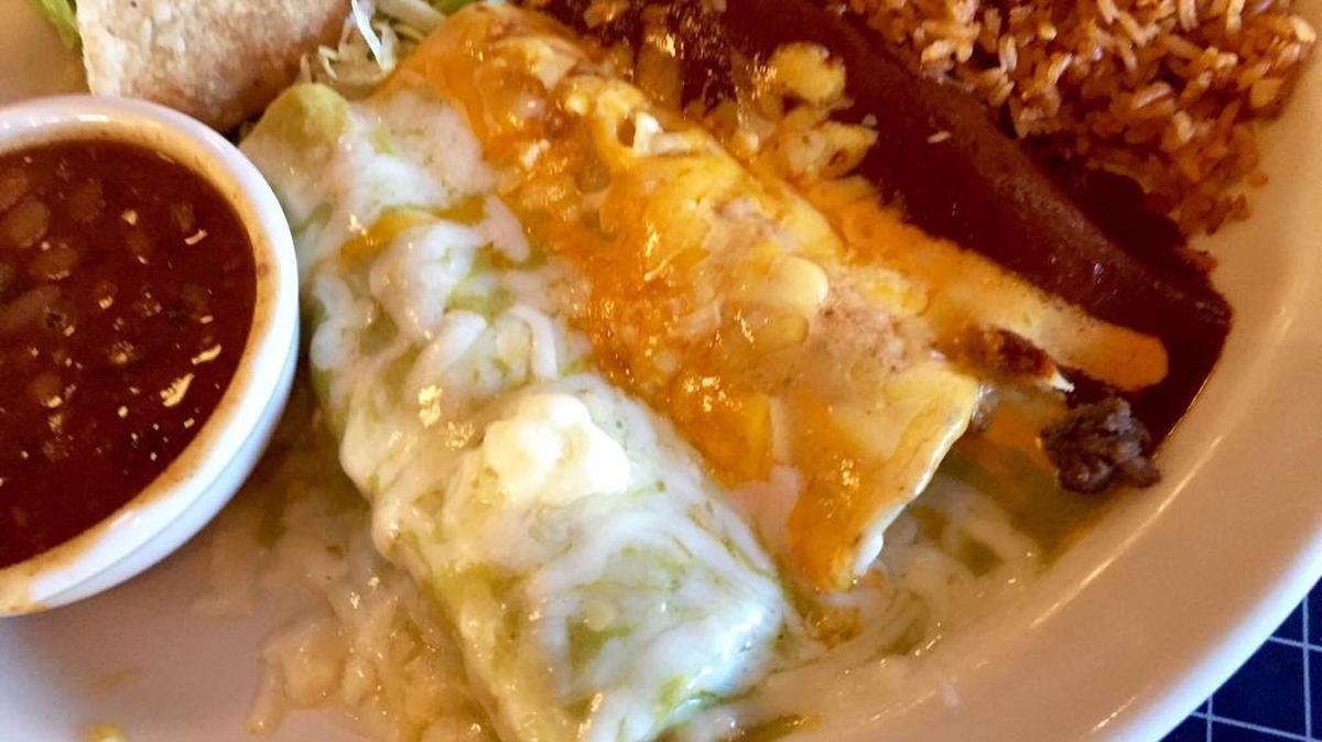 The Uncle Julio’s “Juanita’s Platter” has two enchiladas, a tamal and a taco.