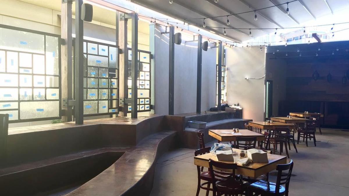 An all-weather patio is a highlight at Olivella’s pizza.