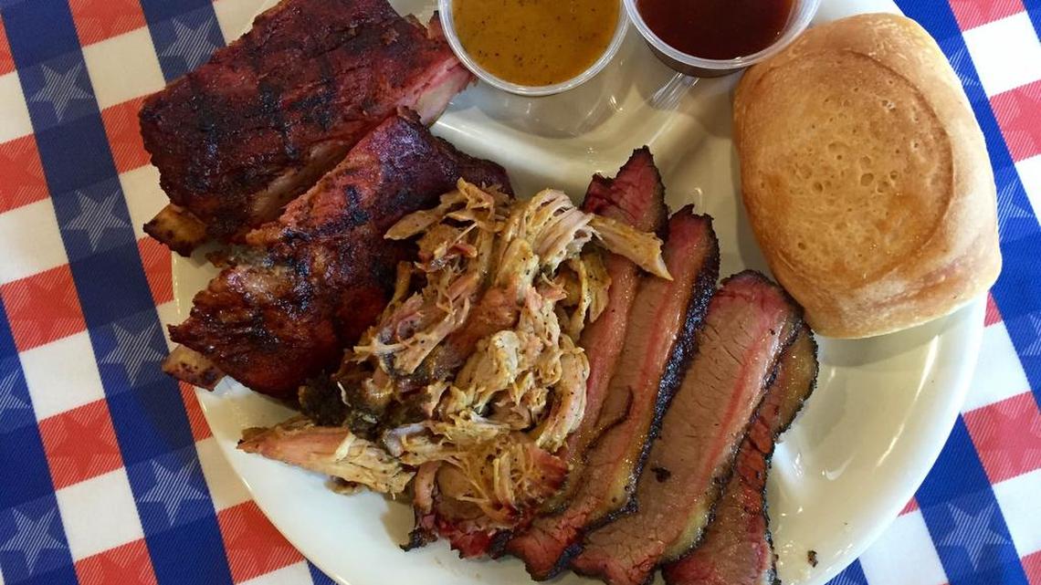A platter of brisket, Carolina pulled pork (with mustard sauce) and ribs at Spring Creek Barbeque.