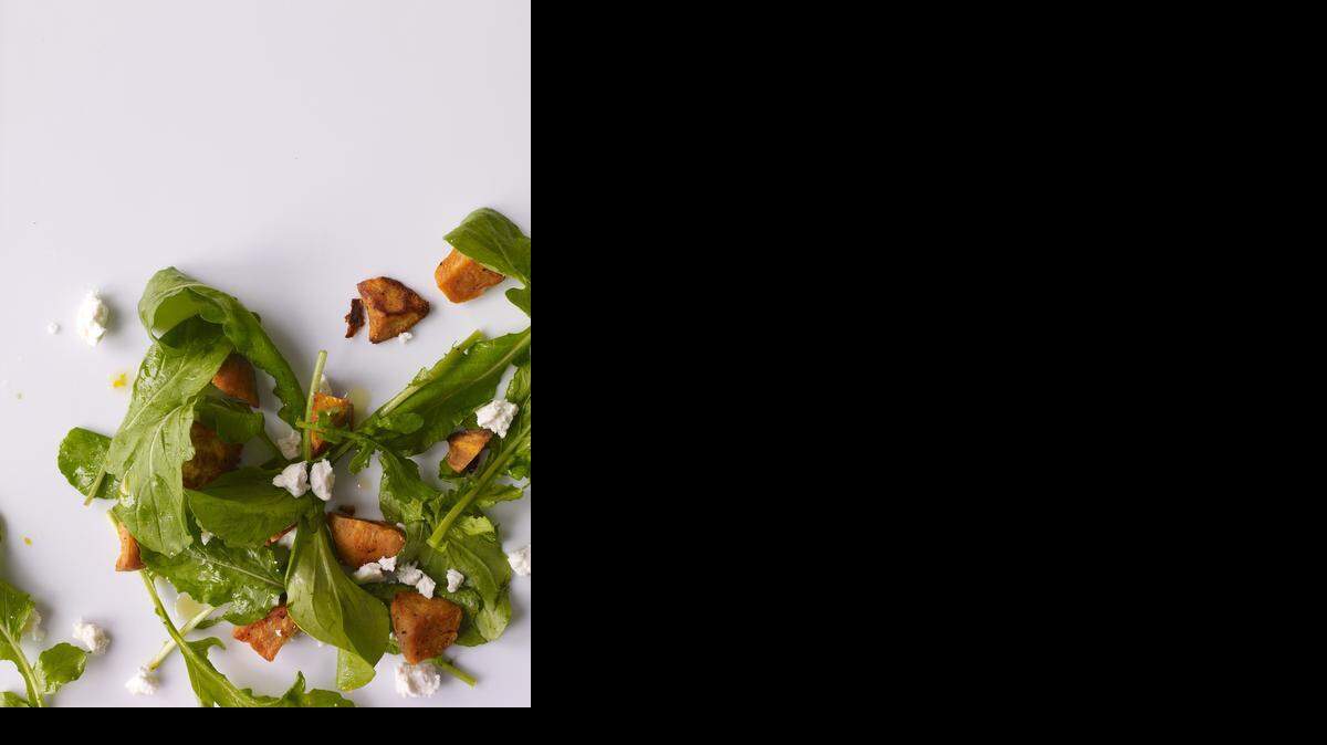 An arugula salad with sweet potatoes and feta goes well with chicken.