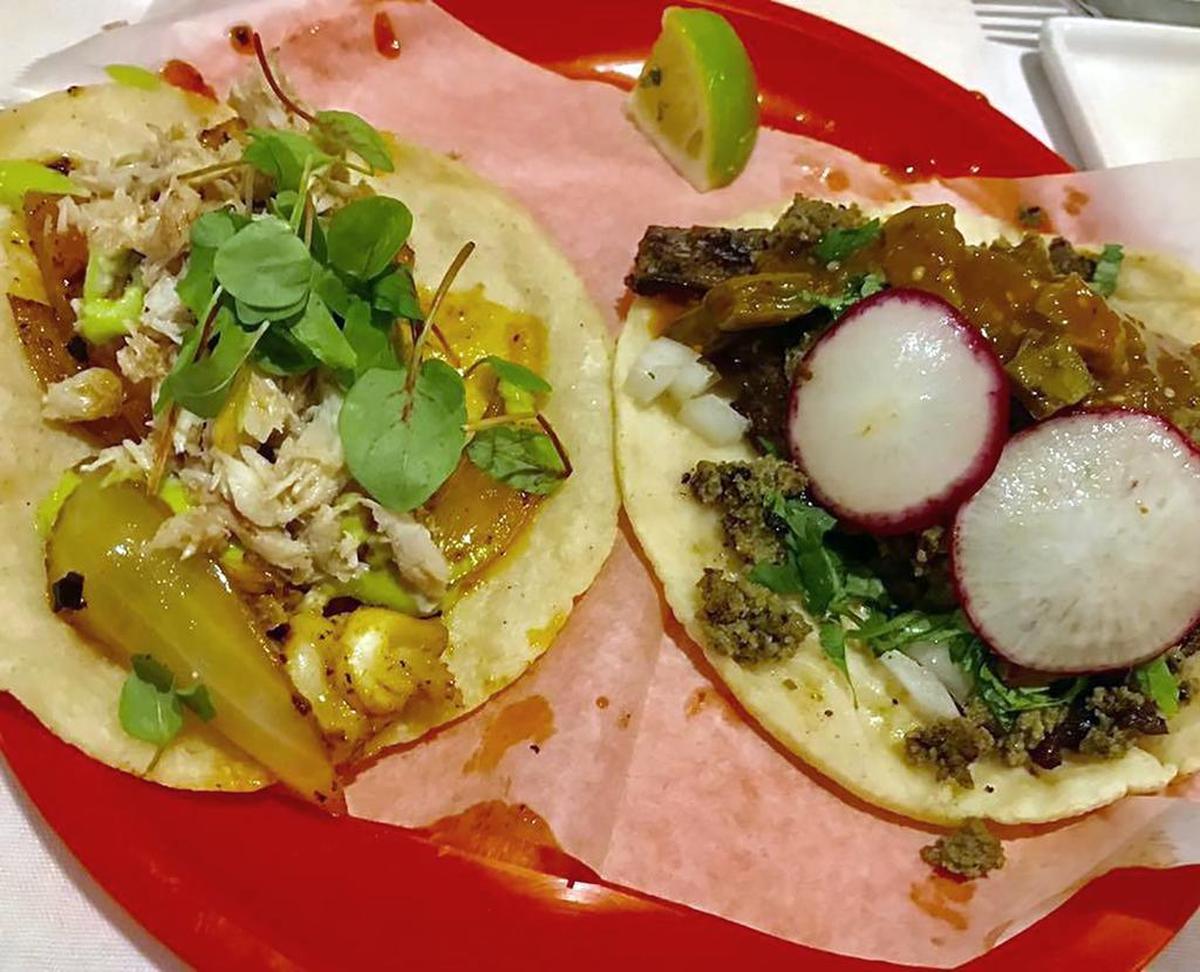 The $7 langosta y cangrejo (lobster and crab) taco, left, and the $5 “Mixto” at Revolver Taco Lounge in Fort Worth