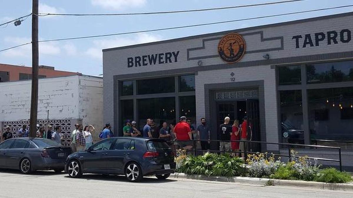 The line begins to form at Collective Brewing Project for patrons to purchase bottles of Blackberry Petite Golden Sour on May 28.
