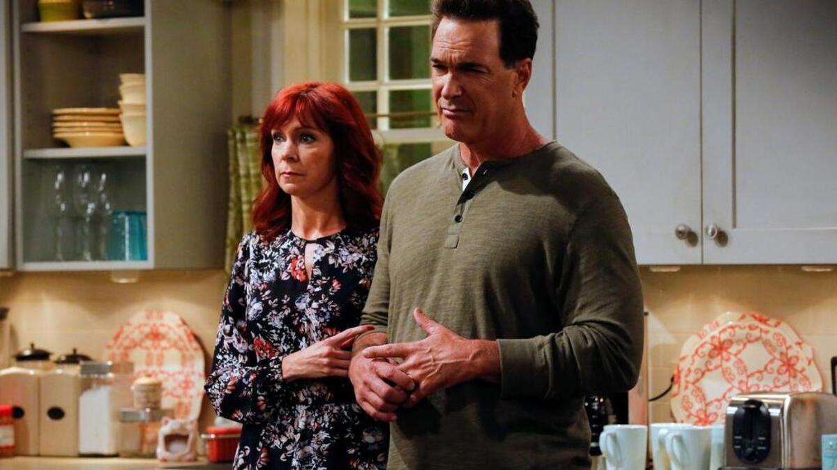 Martina (Carrie Preston) and Mike (Patrick Warburton) share their house with several generations in Crowded .