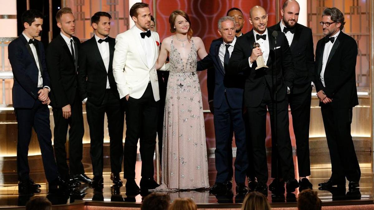 The cast and crew of La La Land accept the award for best motion picture, musical or comedy, on Sunday at the 74th Annual Golden Globe Awards at the Beverly Hilton Hotel in Beverly Hills, Calif.