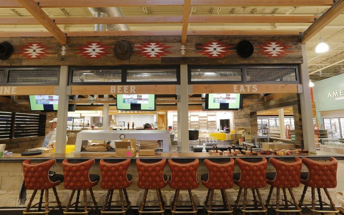 A beer case stocked with local and imported brews, a bar and a cafe are among the amenities at the new Whole Foods Market.