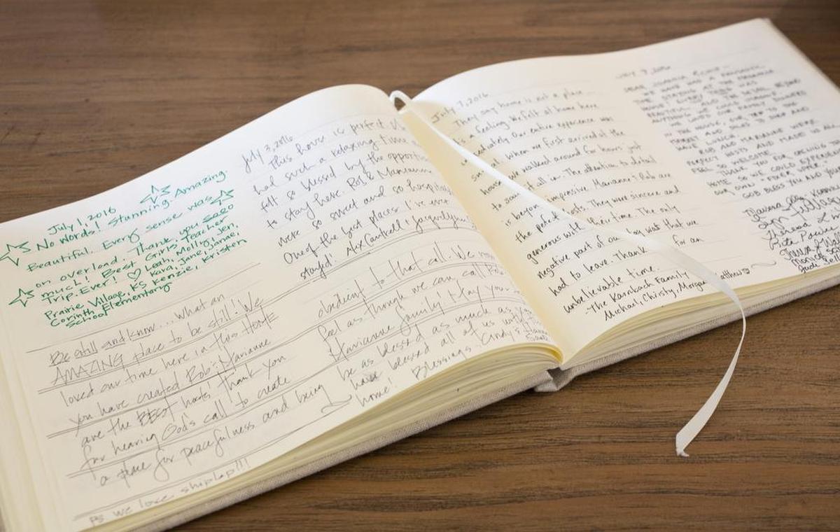 Guests leave heartfelt messages for Chip and Joanna Gaines in the Magnolia House guest book.