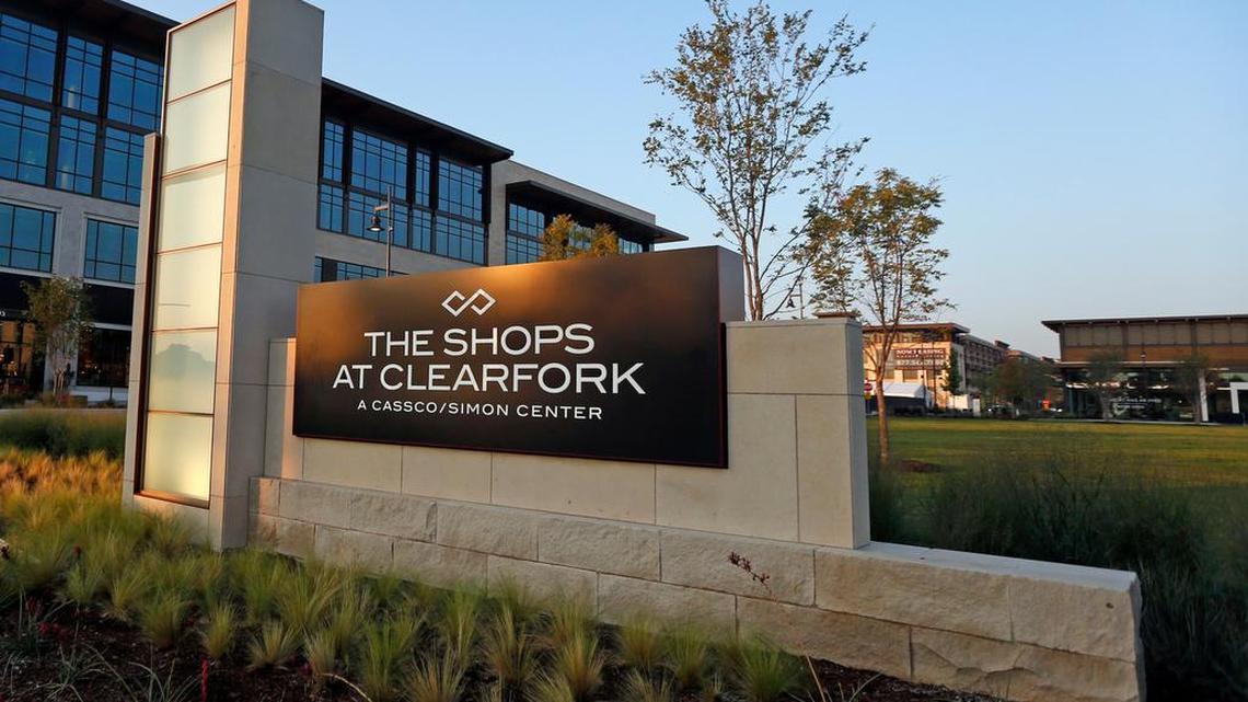 A metal sign positioned on bricks that reads The Shops at Clearfork a Cassco/Simon Center. This marks one of the entrances to the shopping center.
