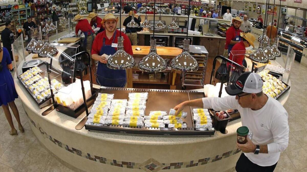 The breakfast burrito counter draws visitors to the center of the new Buc-ee’s in Fort Worth.