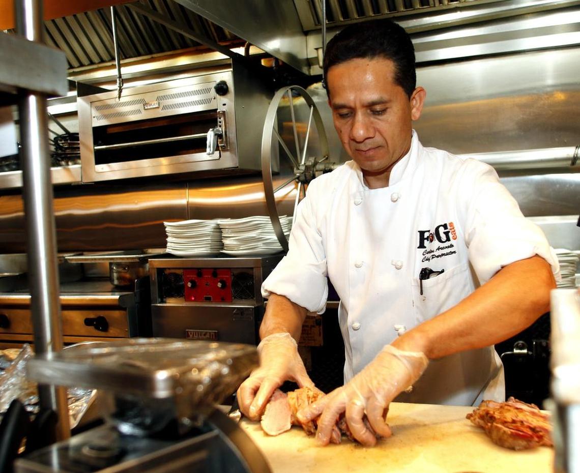 Chef Carlos Arevalo prepares a dish at FnG Eats in Keller.